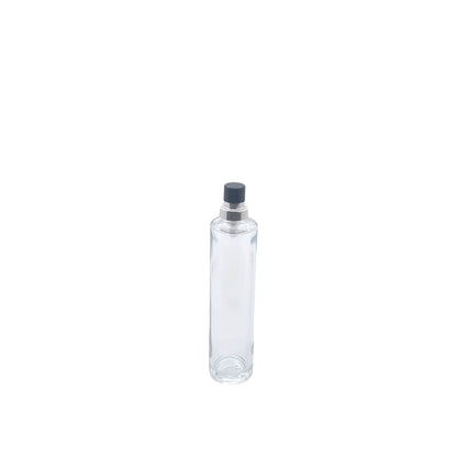 Tall thin fragrance bottle in glass
