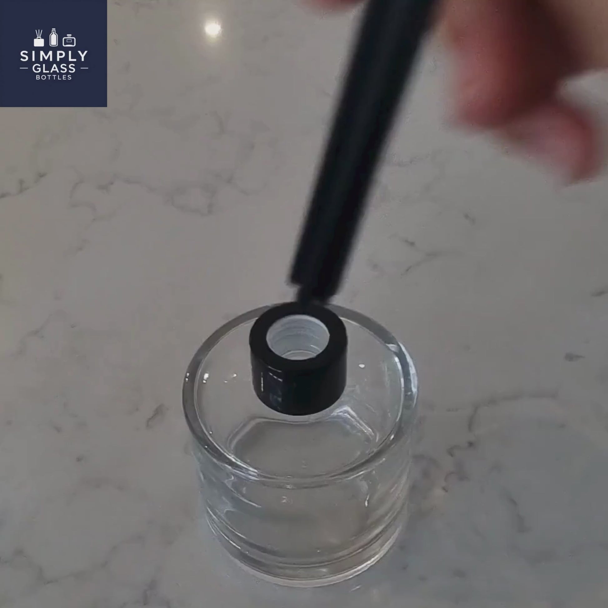 Black reeds in glass diffuser bottle